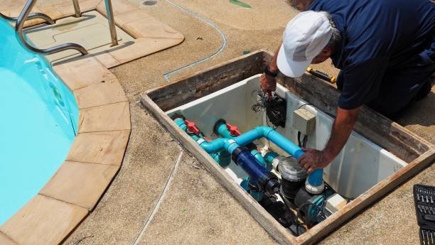 Technician repairing a pool pump to restore circulation in an Akron, Ohio pool.