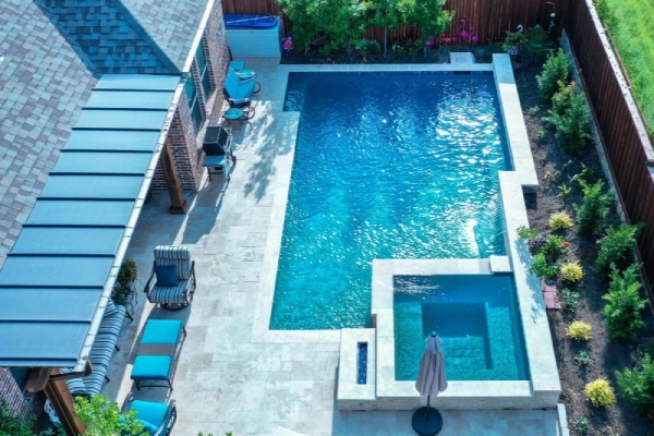 Workers resurfacing and updating a backyard pool in Cleveland & Akron, Ohio.