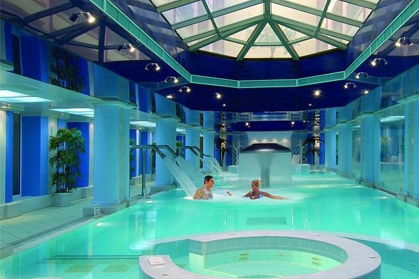 Technician performing seasonal pool and spa opening service in a Cleveland establishment